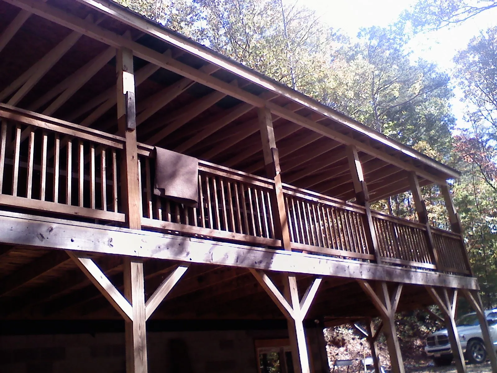 Timber framing under a new elevated porch and deck — Roof Leak Repair in West Warren by Roofing Brothers